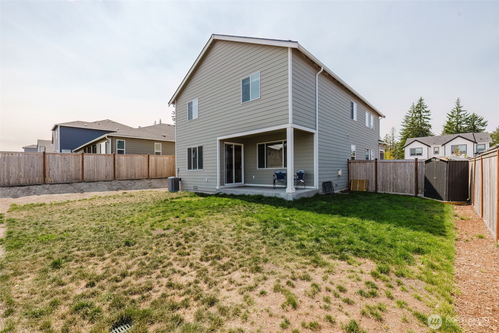 948 Panoramic Loop Bremerton, WA 98312 - Photo 29 of 30 a front view of a house with a garden
