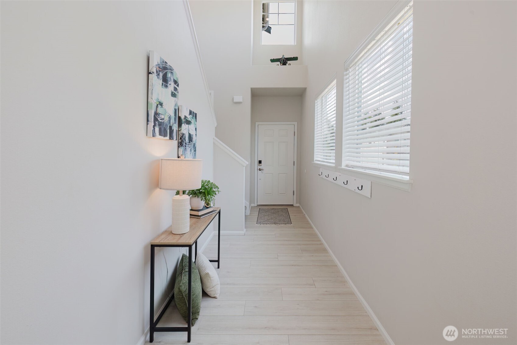 948 Panoramic Loop Bremerton, WA 98312 - Photo 4 of 30 a hallway with table and stairs