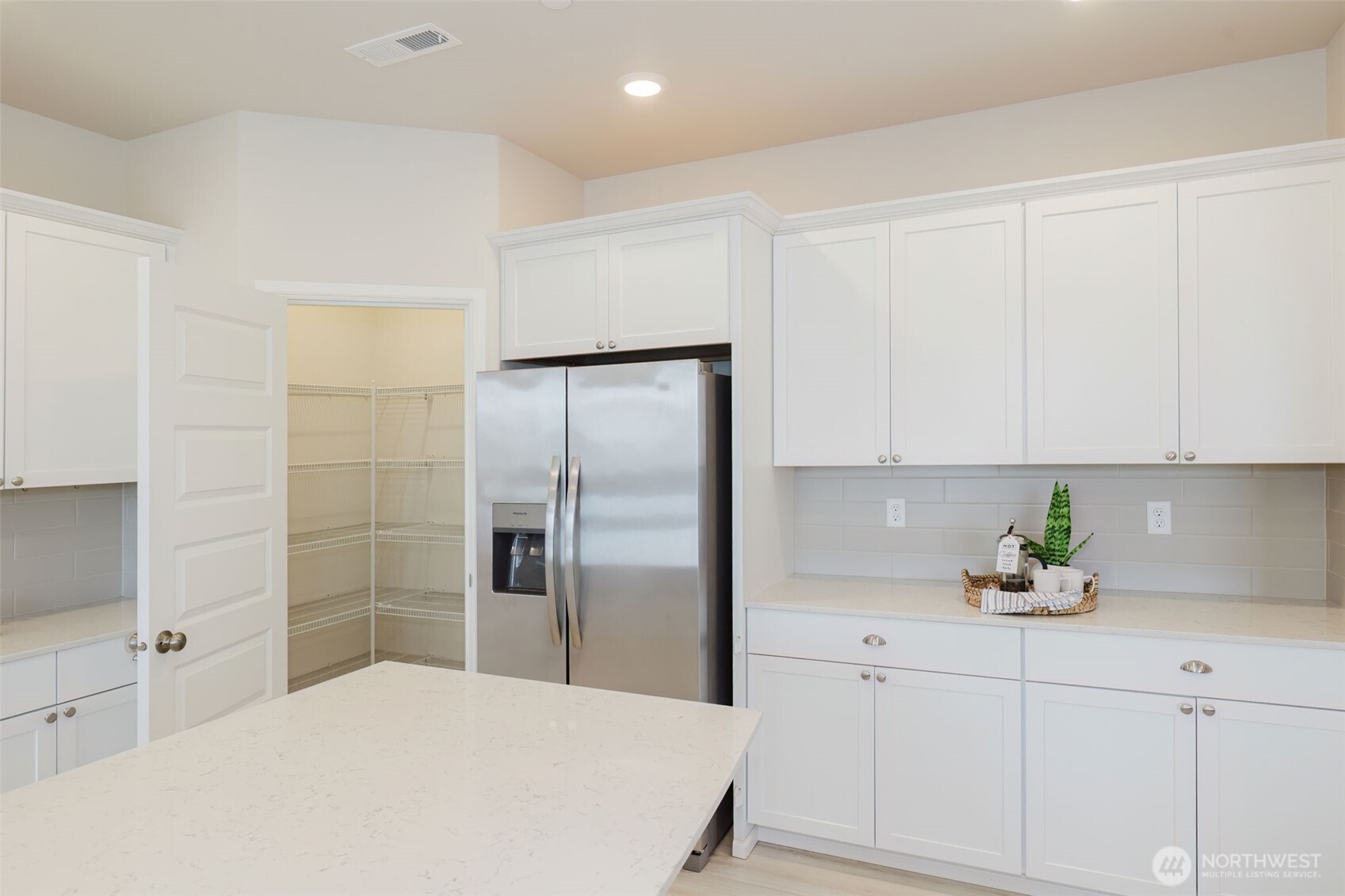 948 Panoramic Loop Bremerton, WA 98312 - Photo 10 of 30 a kitchen with stainless steel appliances a refrigerator sink and cabinets