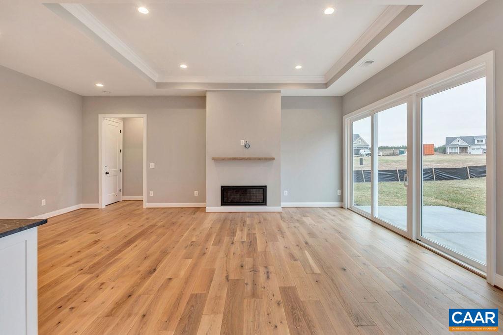 380 Claibourne Road Crozet, VA 22932 - Photo 15 of 25 a view of an empty room with wooden floor and a window