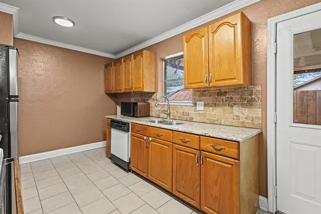 a bedroom with bed and a chandelier