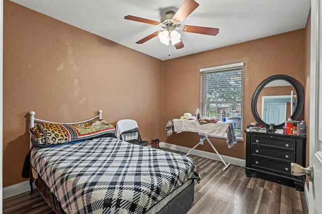 a bathroom with a sink a toilet a mirror a vanity and shower