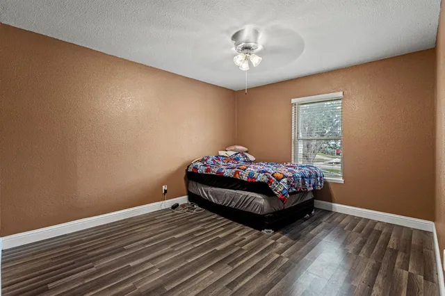 a view of room with window and ceiling fan