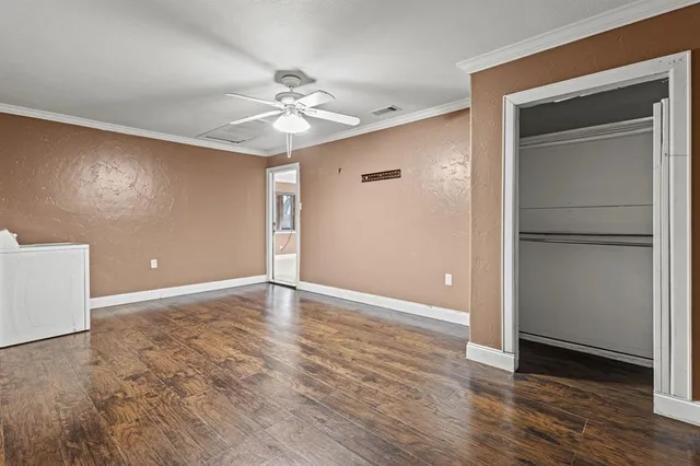 a view of a room with wooden walls