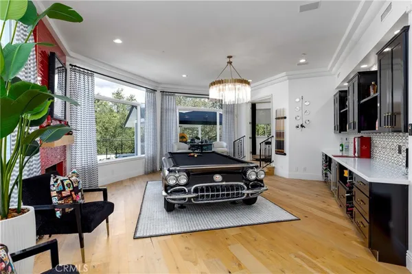 a bed room with a bed tv and a window