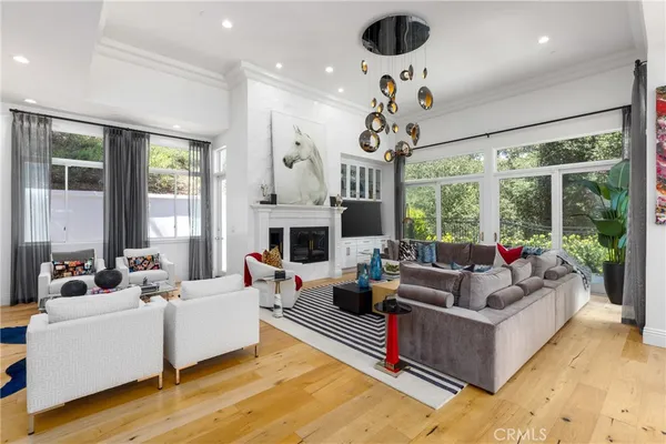 a living room with patio furniture and a large window