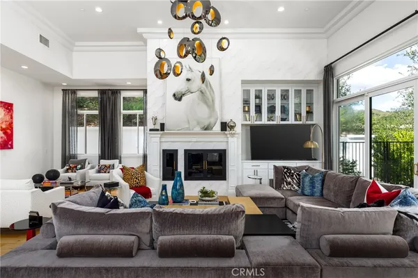 a dining room with furniture and a kitchen view