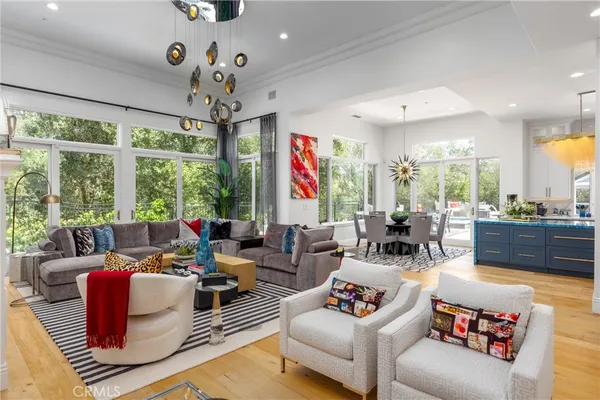 a kitchen with stainless steel appliances granite countertop a stove and large window