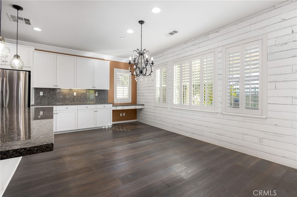 31639 Country View Road Temecula, CA 92591 - Photo 13 of 75 a view of a kitchen with wooden floor and electronic appliances