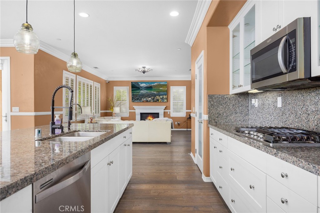 31639 Country View Road Temecula, CA 92591 - Photo 15 of 75 a kitchen with stainless steel appliances granite countertop a sink stove and microwave