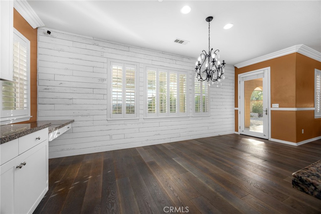 31639 Country View Road Temecula, CA 92591 - Photo 19 of 75 a view of an empty room with a window and wooden floor