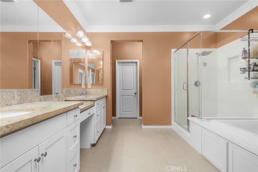 31639 Country View Road Temecula, CA 92591 - Photo 25 of 75 a spacious bathroom with a shower sink and mirror