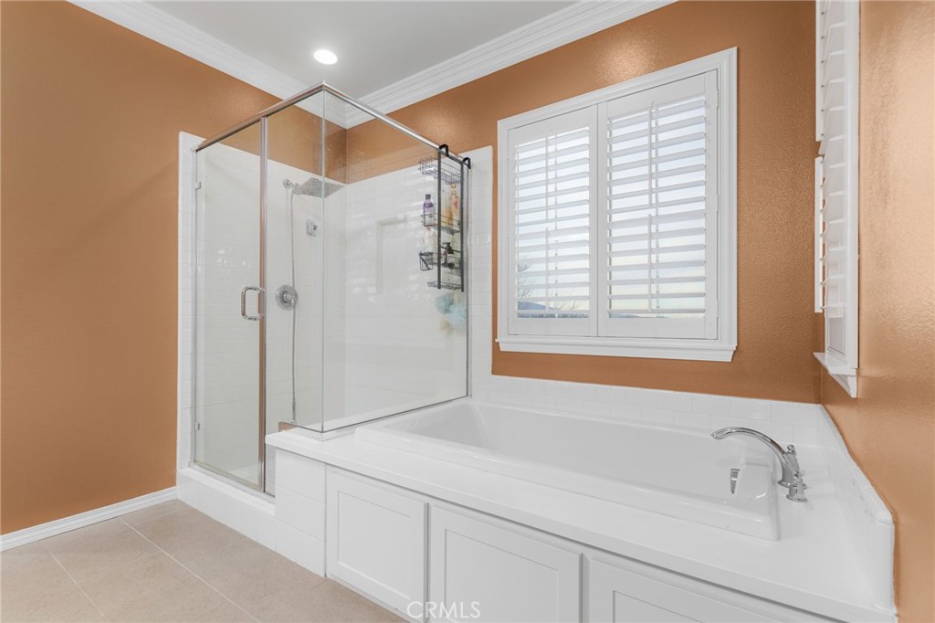 31639 Country View Road Temecula, CA 92591 - Photo 26 of 75 a bathroom with a bathtub and a shower