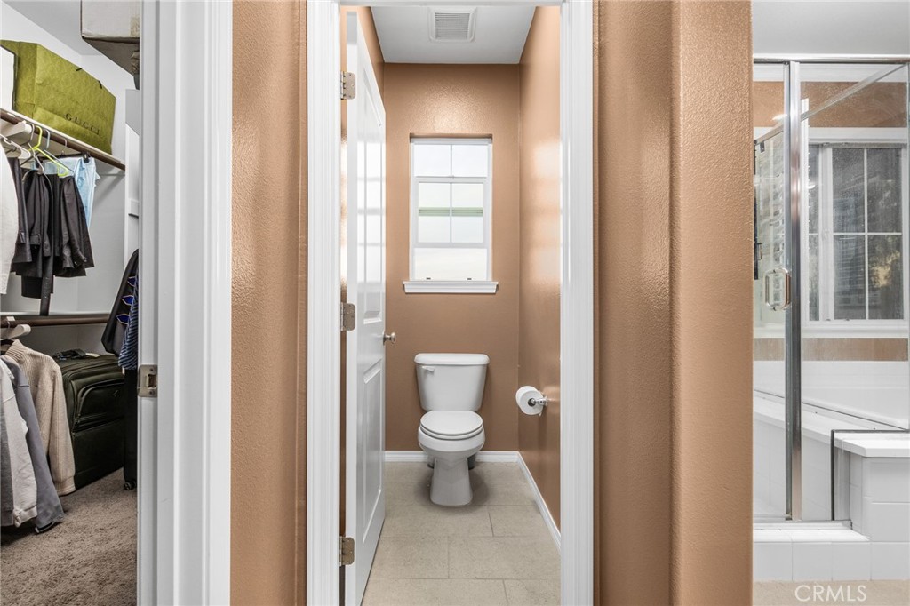 31639 Country View Road Temecula, CA 92591 - Photo 29 of 75 a bathroom with a toilet and a shower