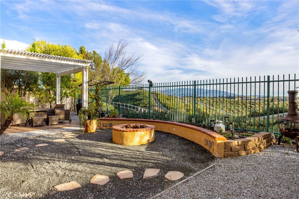 31639 Country View Road Temecula, CA 92591 - Photo 46 of 75 a view of a swimming pool with an outdoor seating