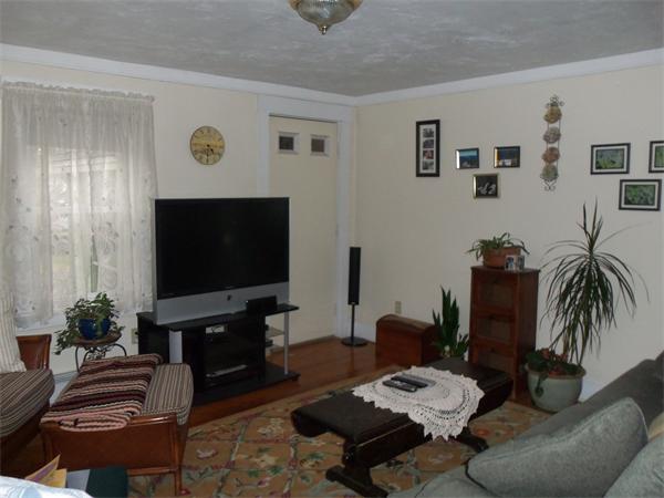 86 S Road Templeton, MA 01468 - Photo 5 of 13 a living room with furniture and a flat screen tv