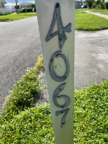 a view of a backyard with plants and outdoor seating