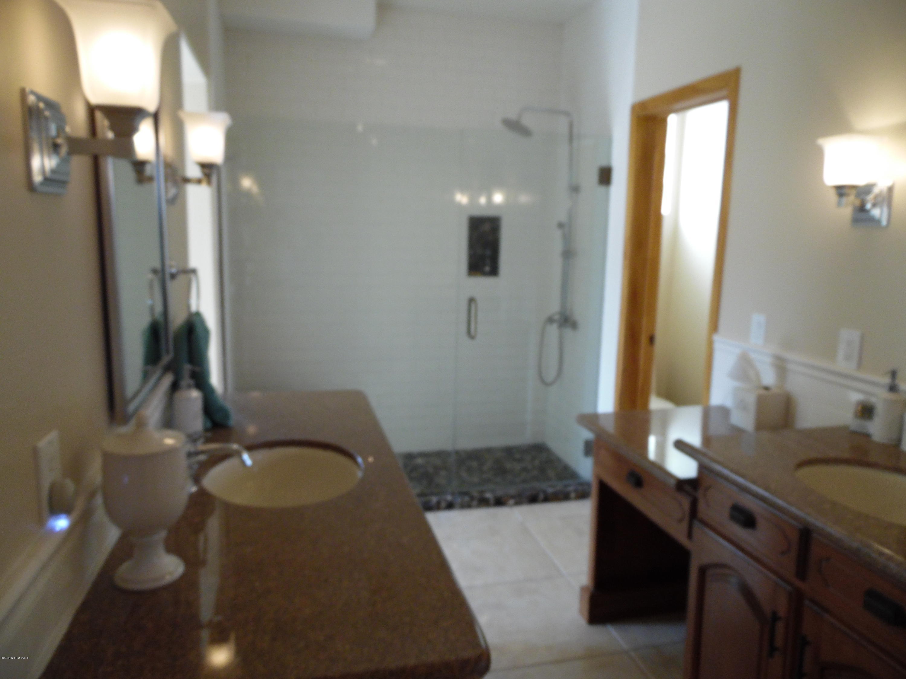 173 Camino Embarcadero Rio Rico, AZ 85648 - Photo 22 of 38 a bathroom with a sink vanity granite tub and a mirror