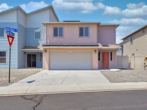 a front view of a house with yard