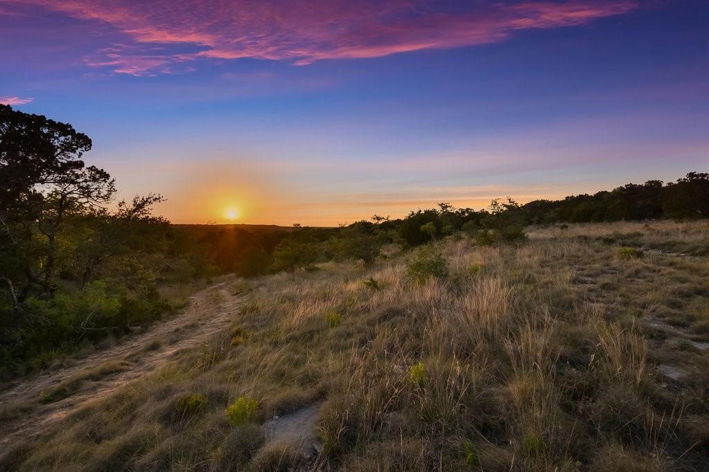 509 Greystone Road Dripping Springs, TX 78620 - Photo 5 of 38 a view of lake and mountain