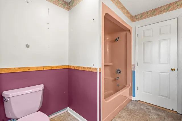 a bathroom with a toilet and a sink