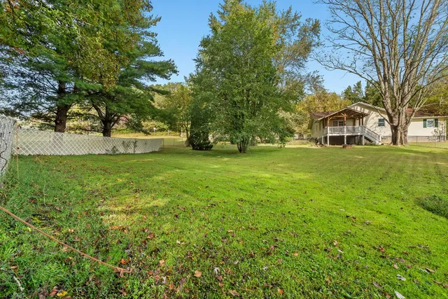 a view of a swimming pool with a patio