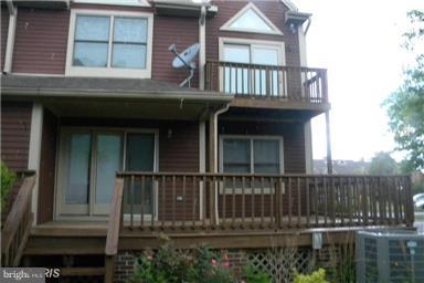 771 Bellefield Road, Unit 133 Dowell, MD 20629 - Photo 2 of 24 a front view of a house with a balcony