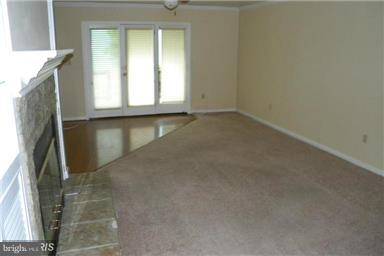 771 Bellefield Road, Unit 133 Dowell, MD 20629 - Photo 13 of 24 a view of an empty room with a window