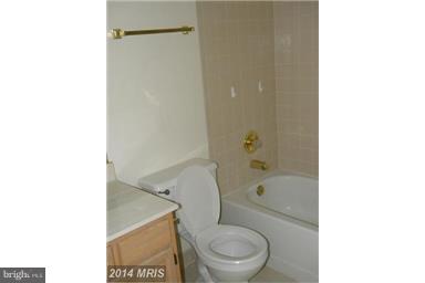 771 Bellefield Road, Unit 133 Dowell, MD 20629 - Photo 15 of 24 a bathroom with a toilet and a shower