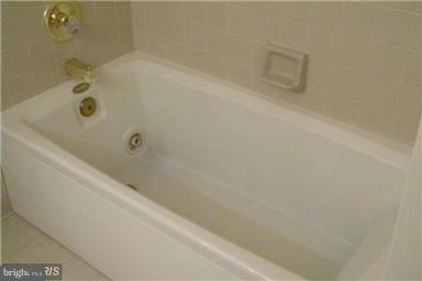 771 Bellefield Road, Unit 133 Dowell, MD 20629 - Photo 22 of 24 a bathroom with a tub