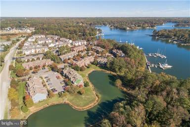 771 Bellefield Road, Unit 133 Dowell, MD 20629 - Photo 5 of 24 an aerial view of residential houses with outdoor space and lake view