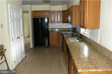 771 Bellefield Road, Unit 133 Dowell, MD 20629 - Photo 9 of 24 a bathroom with a sink and a mirror