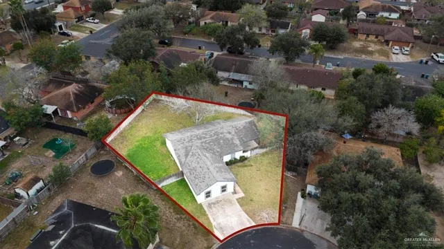 an aerial view of a house with outdoor space