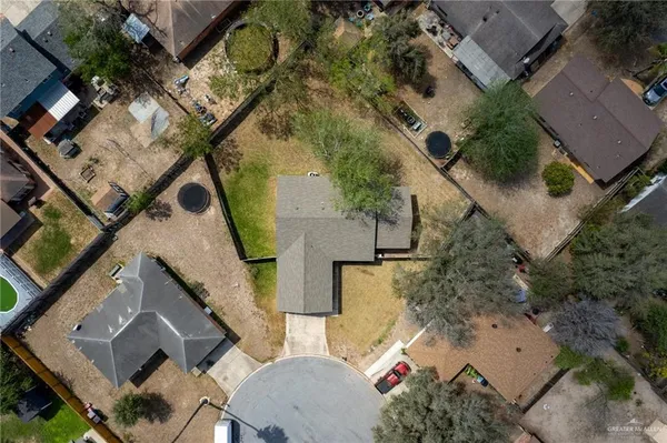 an aerial view of houses with outdoor space