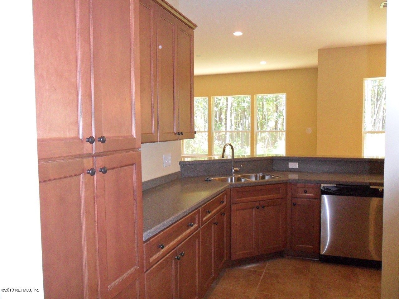 97202 Bluff View Circle, Unit LOT 38 ROSES BLUFF Yulee, FL 32097 - Photo 6 of 14 a kitchen with a sink and a window