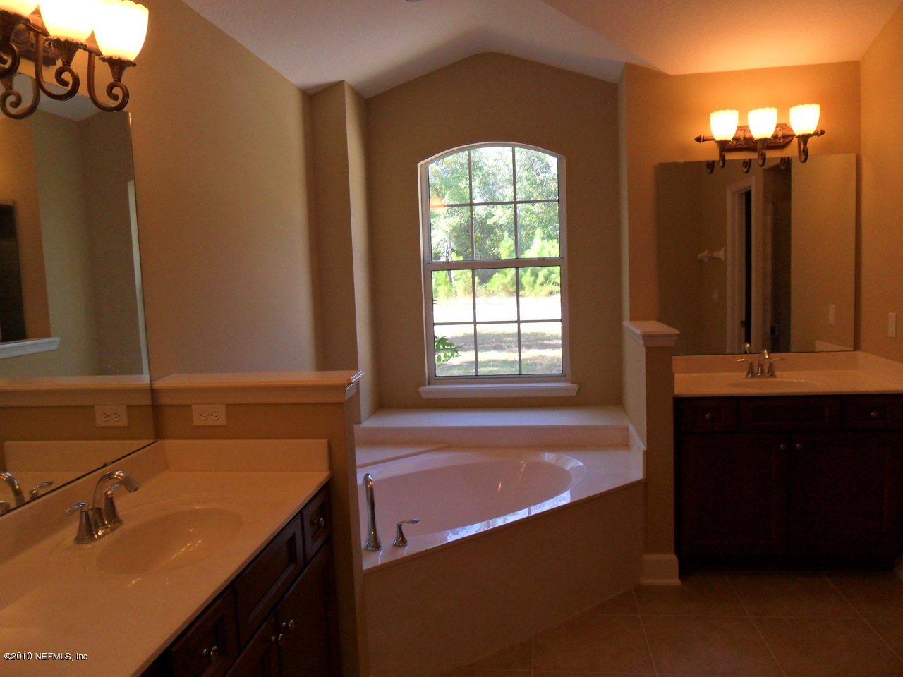 97202 Bluff View Circle, Unit LOT 38 ROSES BLUFF Yulee, FL 32097 - Photo 7 of 14 a bathroom with a sink and a bathtub
