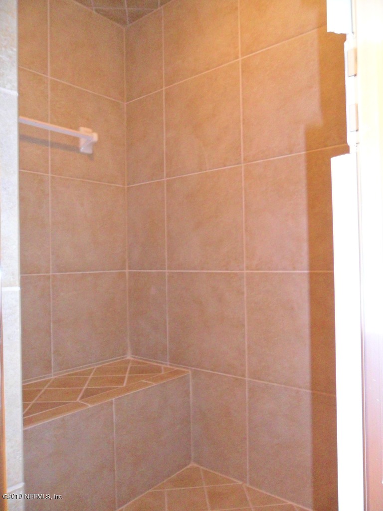 97202 Bluff View Circle, Unit LOT 38 ROSES BLUFF Yulee, FL 32097 - Photo 9 of 14 a bathroom with a shower