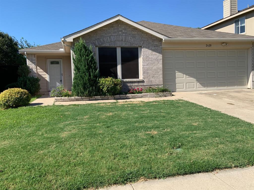 2620 Caprock Road McKinney, TX 75071 - Photo 1 of 19 Ranch-style house featuring a front yard, a garage, concrete driveway, and stone siding