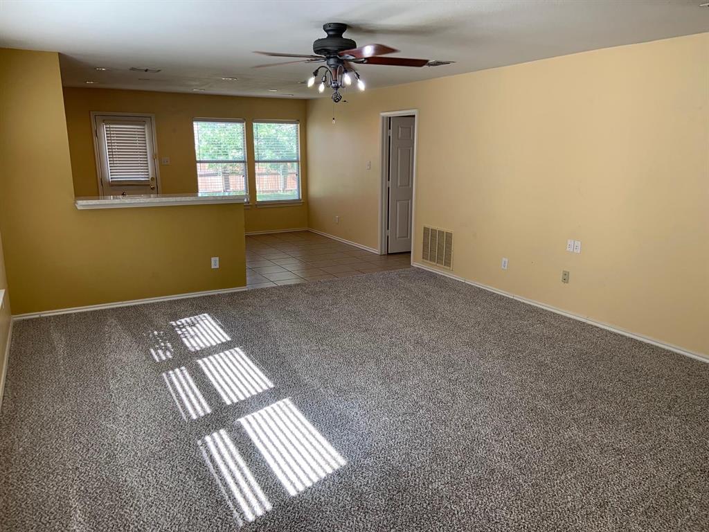 2620 Caprock Road McKinney, TX 75071 - Photo 17 of 19 Empty room featuring ceiling fan and dark colored carpet