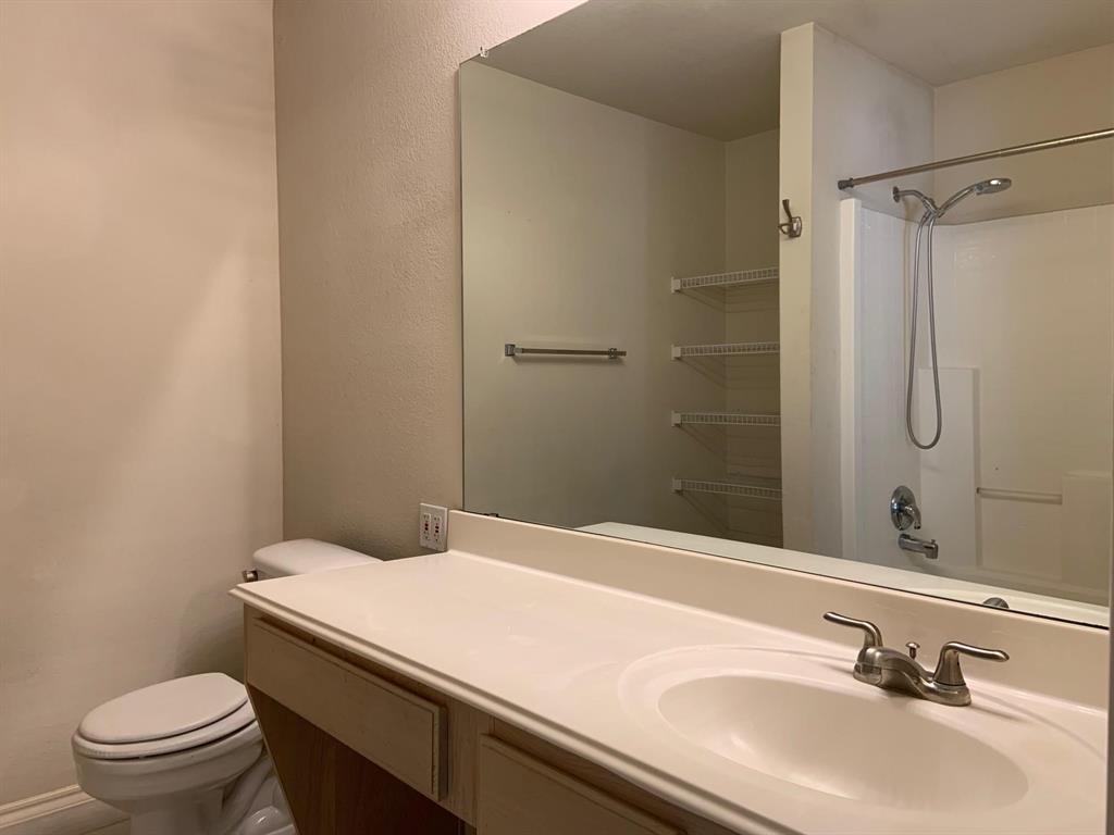 2620 Caprock Road McKinney, TX 75071 - Photo 19 of 19 Full bathroom featuring vanity and a textured wall