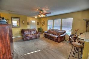 2620 Caprock Road McKinney, TX 75071 - Photo 5 of 19 Living room with ceiling fan and carpet floors