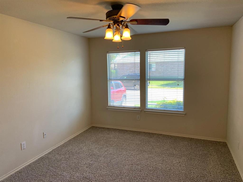 2620 Caprock Road McKinney, TX 75071 - Photo 8 of 19 Carpeted spare room featuring a ceiling fan and baseboards
