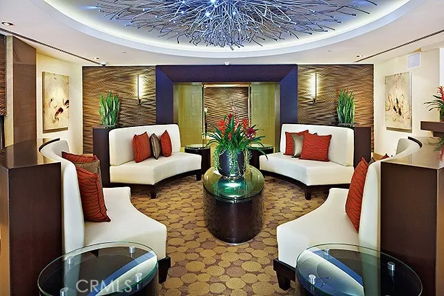 a store room with water heater and wooden floor