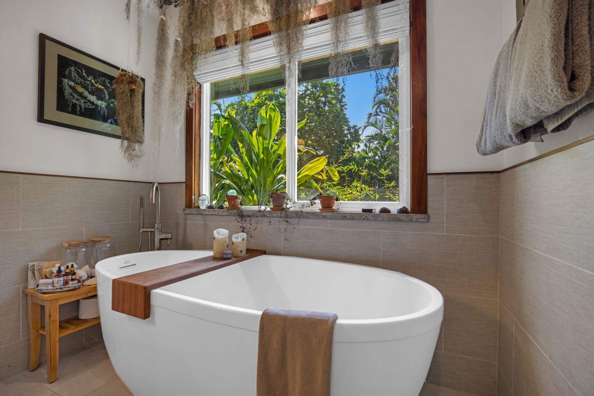 Undisclosed Address Haiku, HI 96708 - Photo 12 of 42 a bathroom with a sink and a window