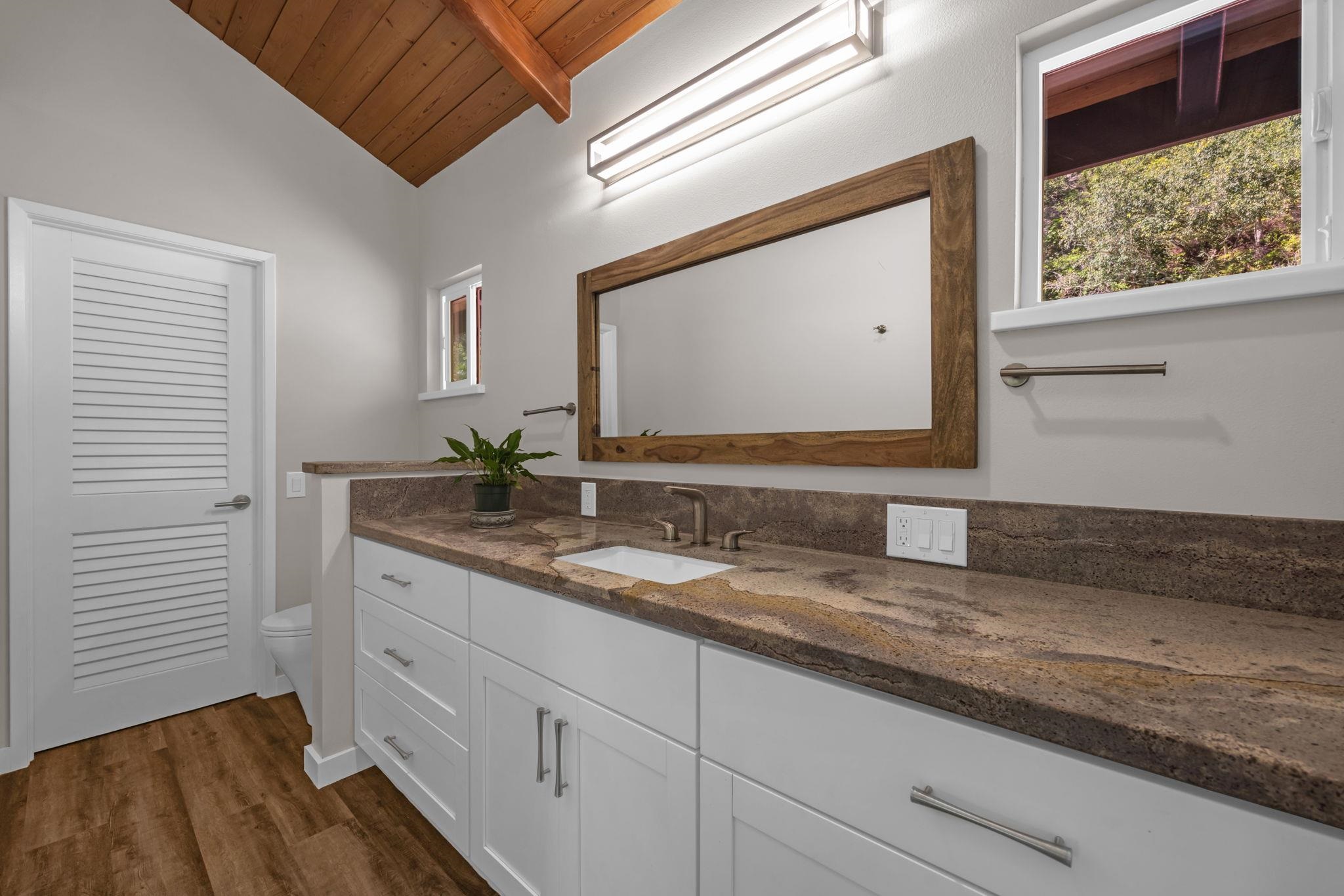 Undisclosed Address Haiku, HI 96708 - Photo 15 of 42 a bathroom with a sink and a mirror