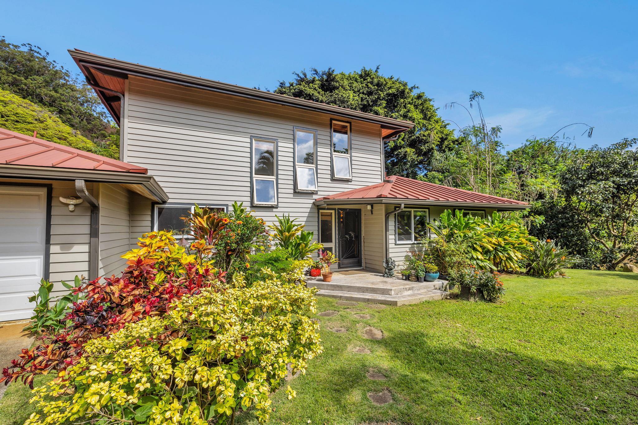 Undisclosed Address Haiku, HI 96708 - Photo 31 of 42 a front view of a house with a yard