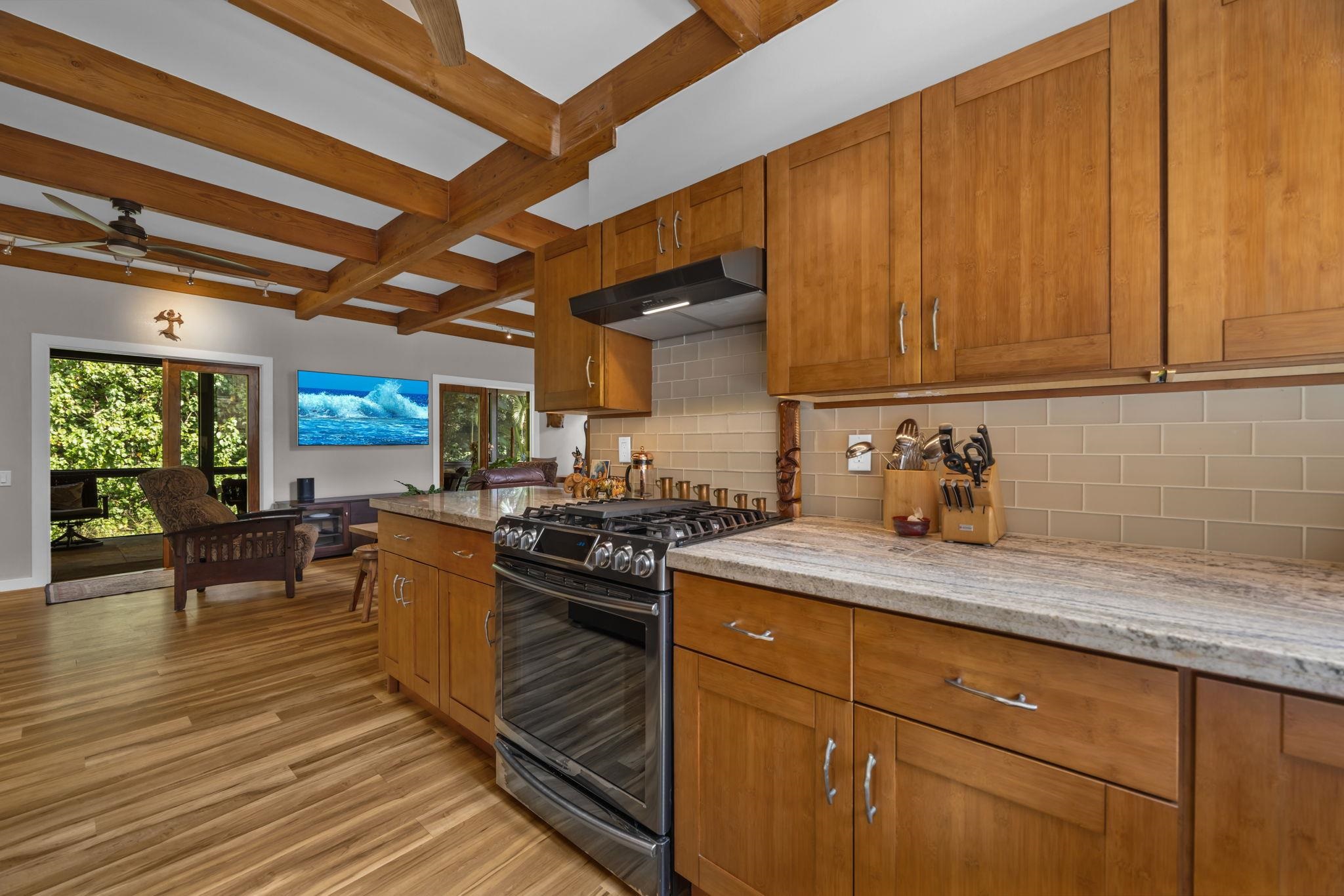 Undisclosed Address Haiku, HI 96708 - Photo 6 of 42 a kitchen with sink cabinets and stove top oven