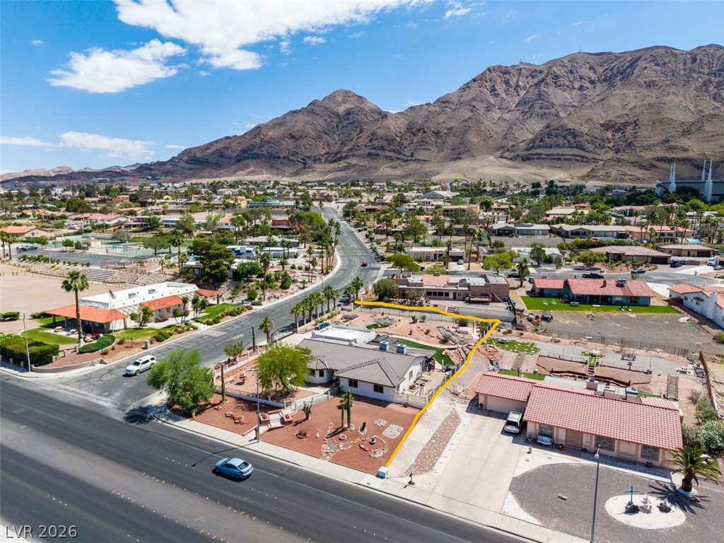 892 North Hollywood Boulevard Las Vegas, NV 89110 - Photo 68 of 81 An aerial perspective reveals a residence nestled within a vibrant community against a mountainous backdrop.