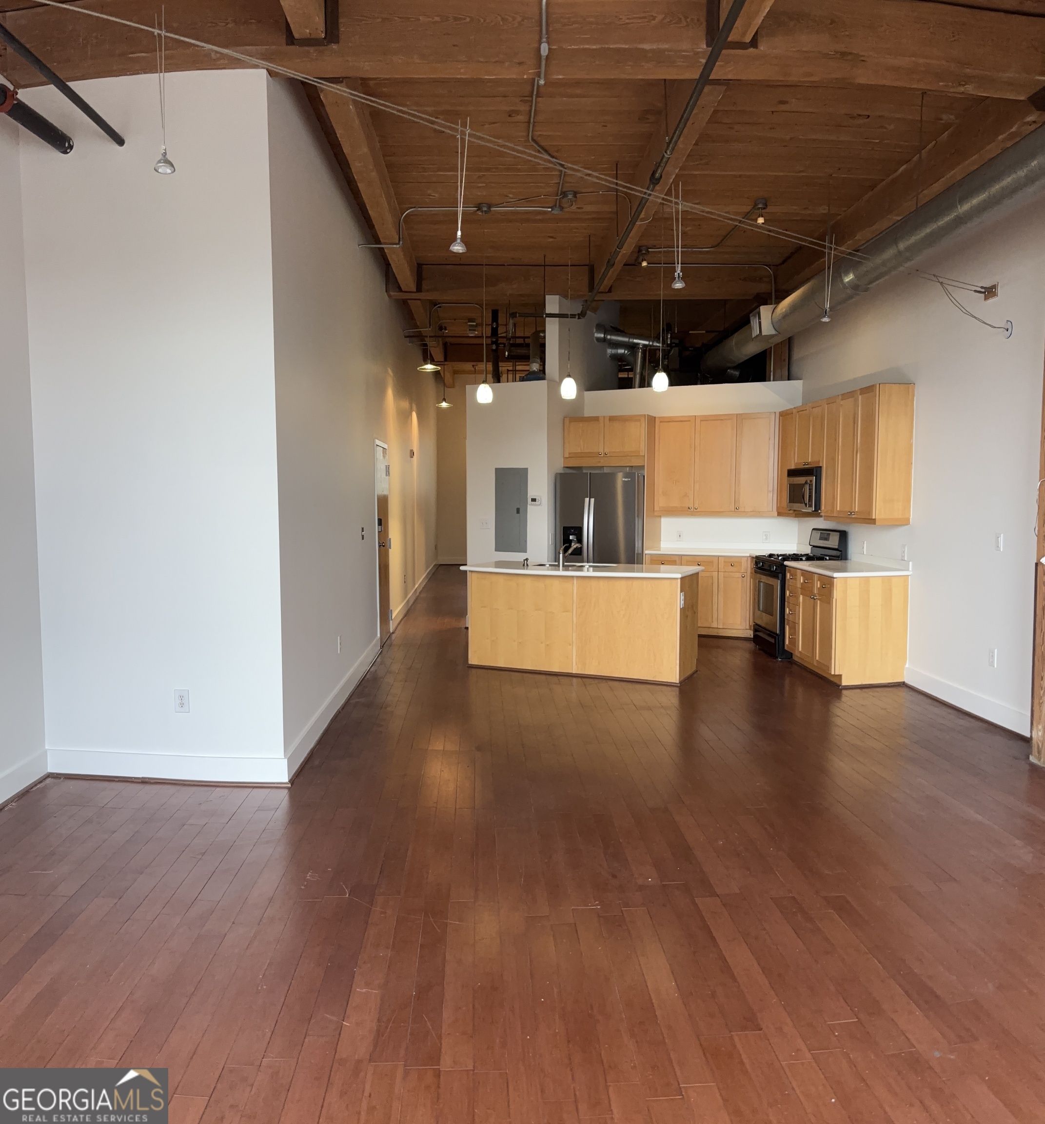 204 Walker Street Southwest Atlanta, GA 30313 - Photo 11 of 43 a view of a big room with wooden floors