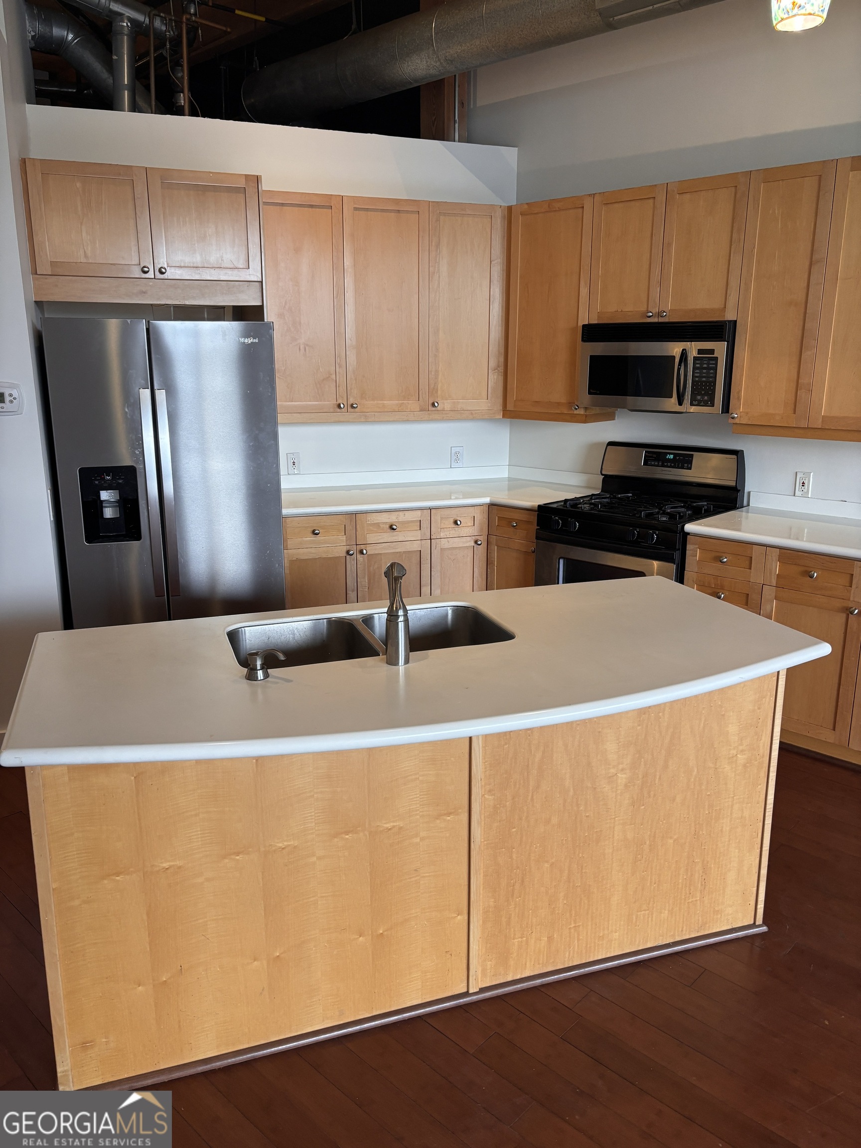 204 Walker Street Southwest Atlanta, GA 30313 - Photo 12 of 43 a kitchen with stainless steel appliances a refrigerator a stove a sink and a microwave
